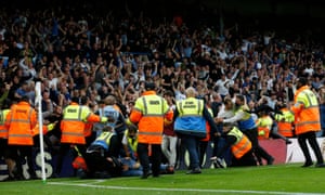 Stewards detain pitch invaders after West Ham United’s Michail Antonio scored their second goal.