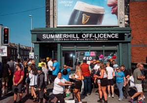 Summerhill Off-Licence with crowds of people outside.