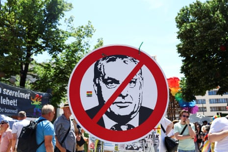A placard with a crossed out image depicting Hungarian Prime Minister Viktor Orban is pictured as people gather for The Budapest Pride March in Budapest.