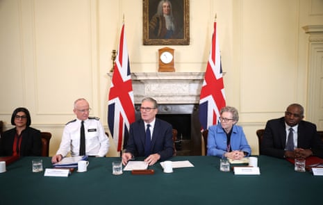 Keir Starmer sat with other officials at a meeting in Downing Street.