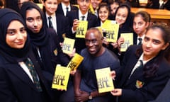YA author Alex Wheatle, pictured with pupils at Yardleys School, Birmingham, in 2019.