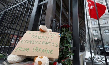 A board with condolences for the victims of the earthquake in Turkey and Syria is seen outside the the Turkish embassy in Kyiv