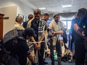 police arrest rabbis in an office building