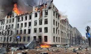 Firefighters extinguishing a fire in the Kharkiv regional police department building, which is said was hit by recent shelling, in Kharkiv on March 2, 2022.