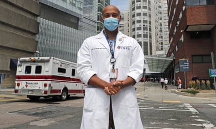 Alister Martin, an emergency room doctor at Massachusetts General Hospital, poses outside the hospital, in Boston