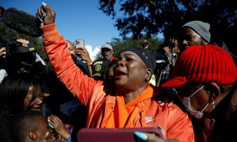 A woman reacts to the verdict outside the Glynn county courthouse in Brunswick, Georgia, on 24 November. 