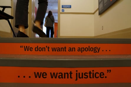 Quotes on the stairs reading “We don’t want an apology … we want justice”