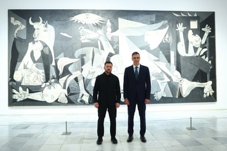 Ukrainian president Volodymyr Zelenskyy poses with Spain’s prime minister Pedro Sánchez in front of Pablo Picasso’s “Guernica” in Madrid Tuesday, 18 Nov., 2025.