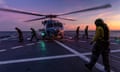 A Seahawk helicopter prepares to take off from the deck of HMAS Hobart