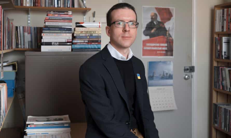 Dr James Ryan in his office at Cardiff University