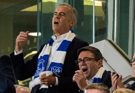 Mark Carney and Andy Burnham cheer on Everton.