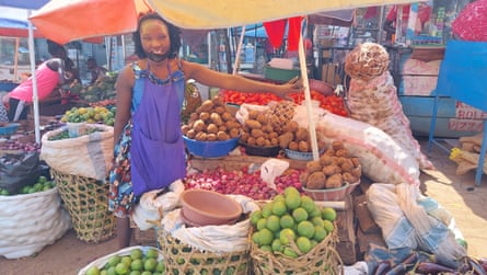 Teacher Racheal Namugaya and the market stall she started to support herself during Covid school closures.