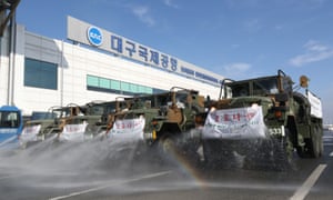 South Korean army trucks spray disinfectant to prevent the spread of the new coronavirus in front of Daegu International Airport in Daegu, South Korea, Friday, March 6, 2020. Seoul expressed “extreme regret” Friday over Japan’s ordering 14-day quarantines on all visitors from South Korea due to a surge in viral infections and warned of retaliation if Tokyo doesn’t withdraw the restrictions.