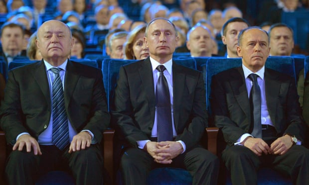 Vladimir Putin with the head of FSB director Alexander Bortnikov (right) and other officials on Security Services Day in Moscow in 2015.