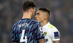 Arsenal's Ben White clashes with Leeds United's Raphinha.