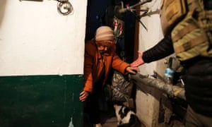 Russia-Ukraine war latest: western officials urge caution over Russia’s peace talk promises – live | World news 3 Elizabeth Kaplun, 81, is helped by her grandson, Yuriy Kaplun, 33, and Steve, a security adviser of journalists, as she enters a bomb shelter located near a destroyed Ukrainian government administration building following a bombing in Mykolaiv.