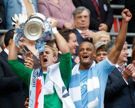 Manchester CityâÂÂs Joe Hart and Vincent Kompany celebrate after the teamâÂÂs victory in the 2011 FA Cup final.