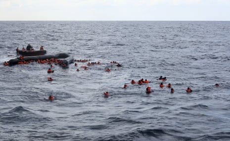 Migrants are rescued by members of the Spanish NGO Proactiva Open Arms