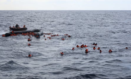 Refugees and migrants being rescued by members of Open Arms.