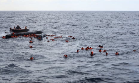 Refugees and migrants being rescued by members of the Open Arms from the Mediterranean Sea on Wednesday.