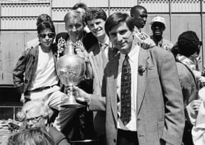 Lee Dixon (behind the trophy) celebrates winning the league title with Arsenal in 1989.