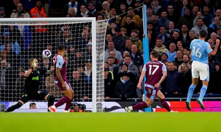 Manchester City’s Rodri smashes the ball past the Aston Villa goalkeeper Robin Olsen to open the scoring