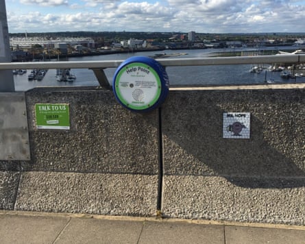 Small mosaic tile of a lantern waving installed onto a bridge