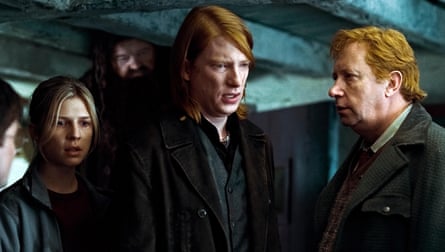 Two red-headed men and a blond girl