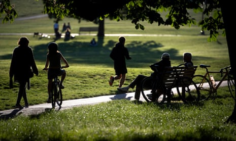 People relaxing and exercising in a park in central London