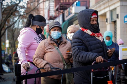 People line up to receive free holiday boxes of food from the Food Bank For New York City ahead of the Thanksgiving holiday, as the global outbreak of the coronavirus disease (COVID-19) continues, in the Harlem neighborhood of New York, US.