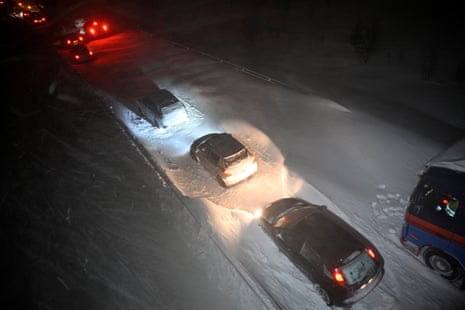 Vehicles stuck on the E22 after heavy snowfall at Ekerod, Sweden, on 3 January