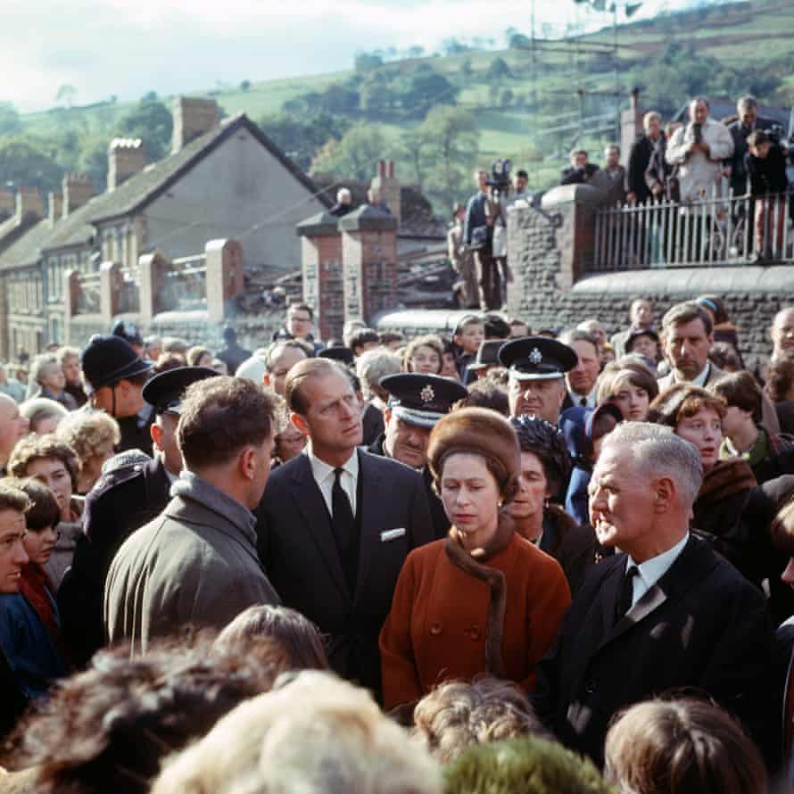 The Queen and Prince Philip surrounded by people, on a visit to Aberfan, eight days after the collapse of a colliery tip that killed 144 people in the Welsh village.