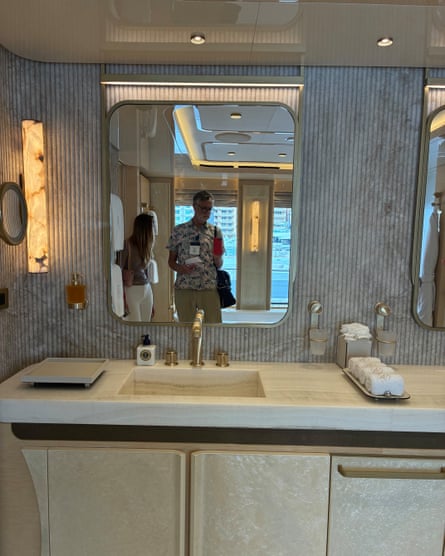 A mirror and sink in a bathroom on one of the superyachts