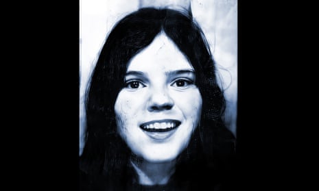 Black and white photograph of a teenage girl, who has long dark hair and is smiling at the camera