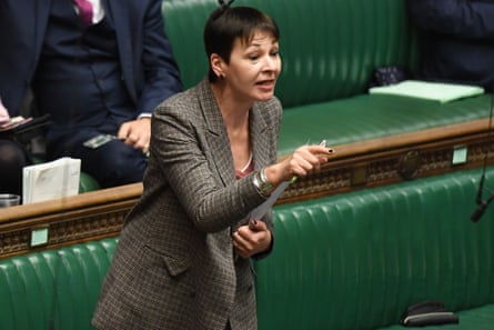 Caroline Lucas points at the opposite benches as she speaks in the House of Commons.