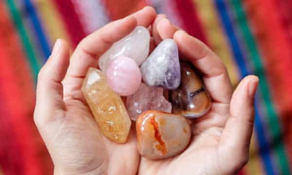 A woman holding crystals