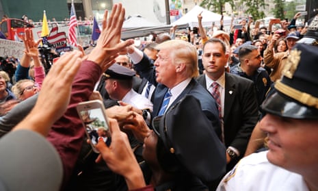 Donald Trump greets supporters outside of Trump Towers