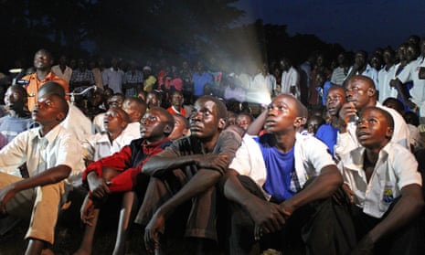Ugandans watch a screening of Kony 2012