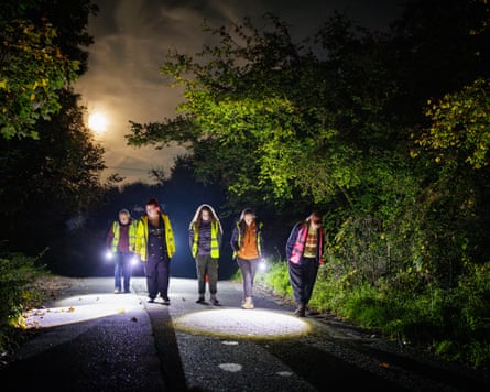 Warminster toad patrol out one night wearing high-vis jackets and using torches.