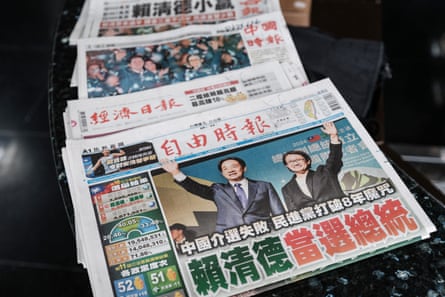 Local newspapers cover the ruling DPP victory on the front pages.