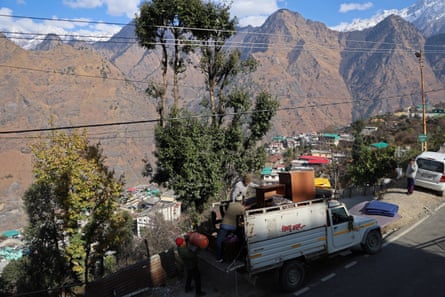 Bikram Singh Chauhan, 49, loads his belongings on to a truck.