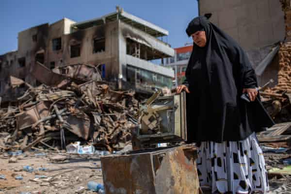 Halima Abdirahman Nur stands in the rubble at Waheen