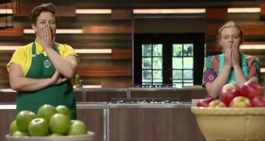 Two people with hands over their mouths in shock