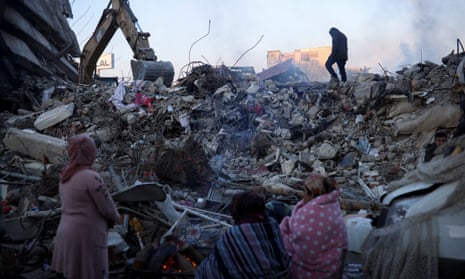 People gather at the rubble in the aftermath of the deadly earthquake in Kahramanmaras, Turkey