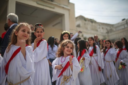 Orthodox Christians attend the Palm Sunday procession in Gaza City on 1 April