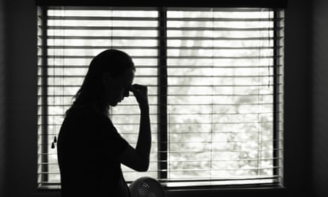 Silhouette of stressed young woman in the bedroom. 