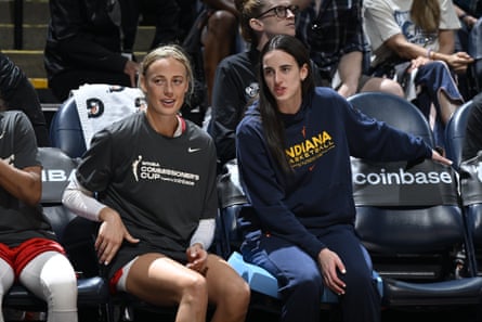 Sophie Cunningham, left, and Caitlin Clark look on during a game.