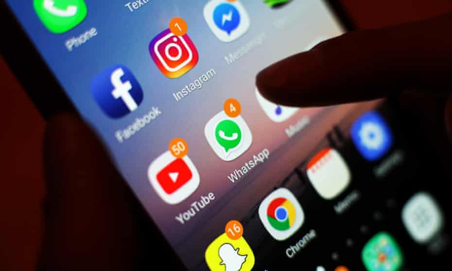 The icons of social media apps, including Facebook, Instagram, YouTube and WhatsApp, displayed on a mobile-phone screen