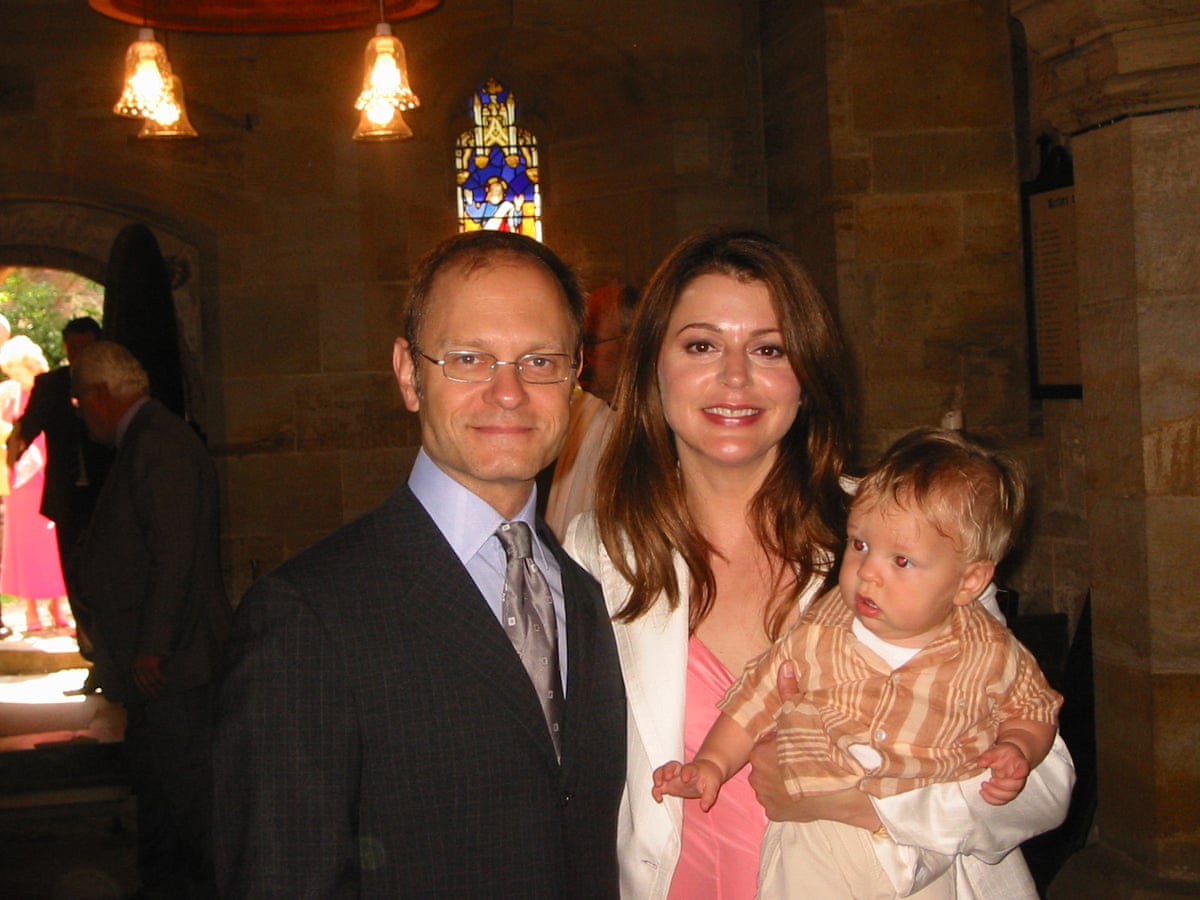 The two actors in a church with her baby