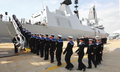 The crew of the Type 45 Destroyer HMS Dragon, march aboard as she is handed over to the Royal Navy. HMS Dragon, is at risk of breakdown in water ‘warmer than in Portsmouth harbour’.